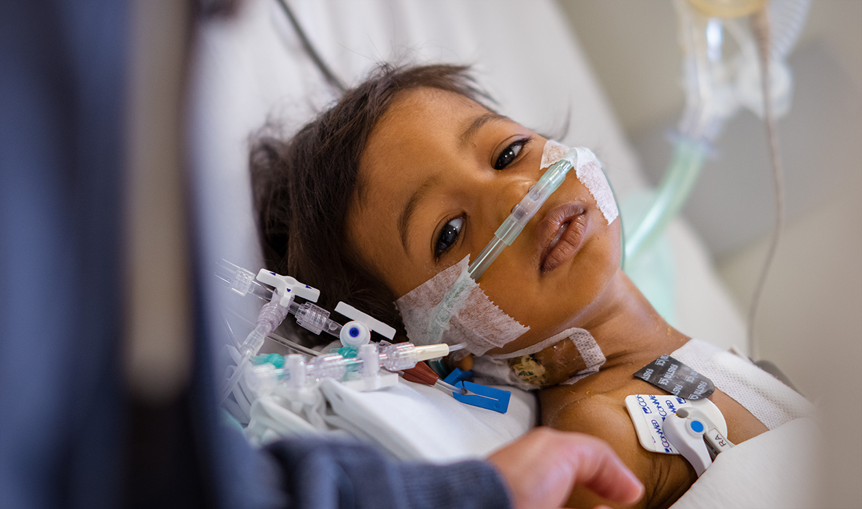 One-year-old Yailin recuperates after successful valve repair surgery in 2022.
