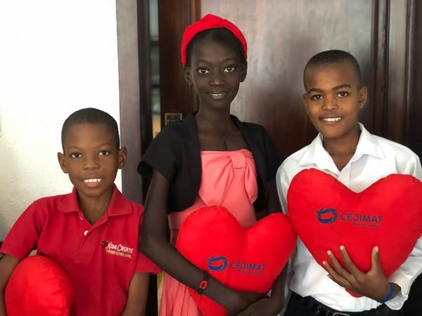 Naika and two other patients hold heart pillows after mitral valve repair surgery