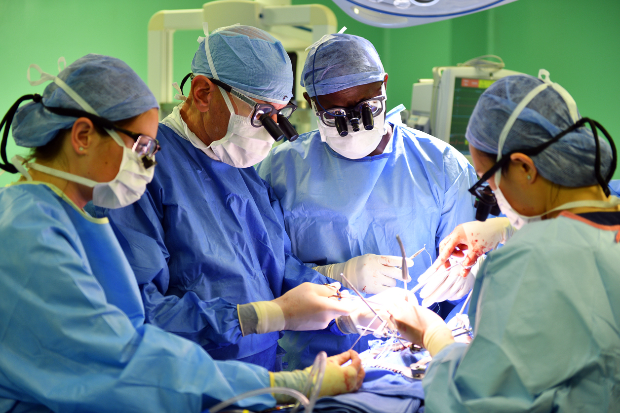 Drs. Adams and Anyanwu perform mitral valve repair surgery during the medical mission. 