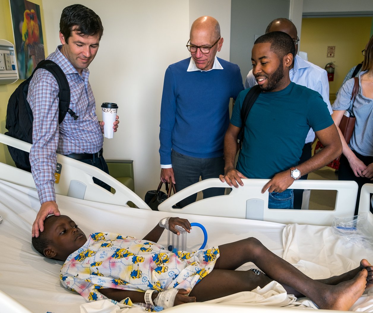 Before his surgery, Woodmylens meets Dr. Adams and team members from the Mitral Foundation and Haiti Cardiac Alliance.