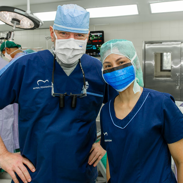 Dr. Adams and Mary Joy in the operating room during a 2015 medical mission to Thailand.