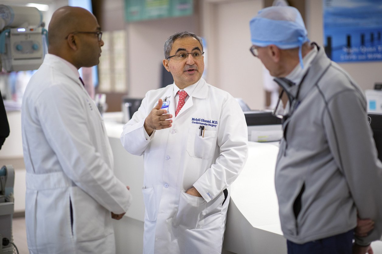 Dr. Oloomi consults with Drs. Adams and Varghese in the ICU at The Mount Sinai Hospital