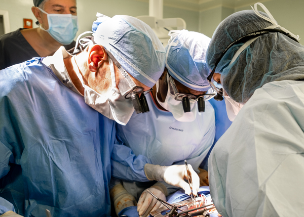 Dr. Adams and his partner Dr. Ani Anyanwu, with Physician Assistant Erica Guidicipietro, repairing Woodmylens’ mitral valve, while demonstrating the complex technique to Dr. Juan Leon (back) at CEDIMAT Hospital.